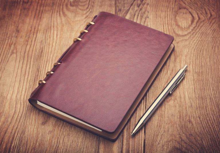 shutterstock notebook and pen on wood background memoirs diary