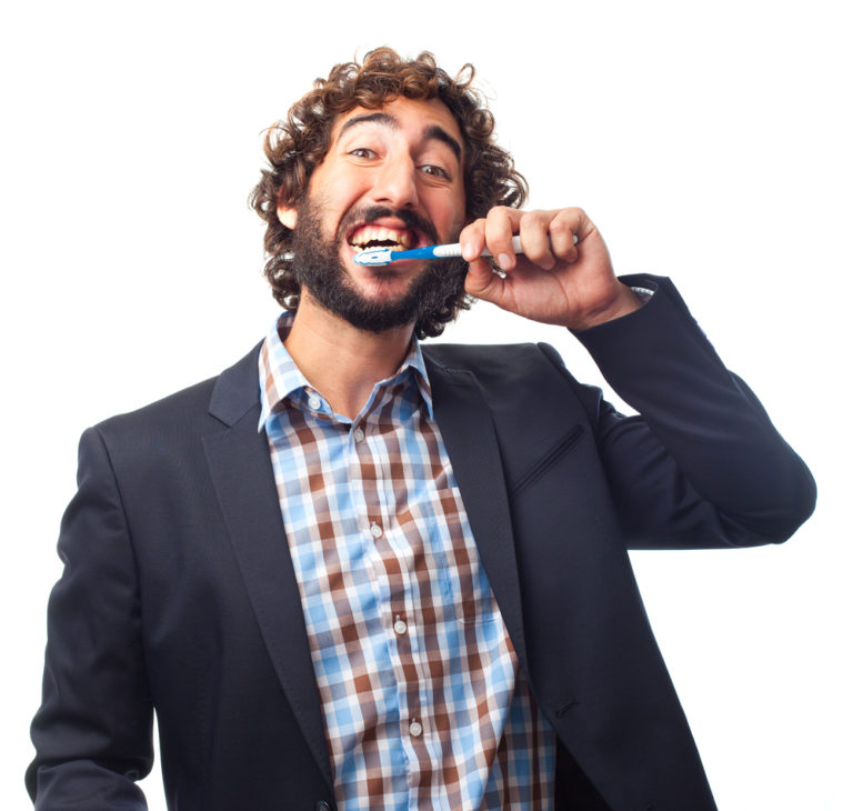 shutterstock_221802256 young crazy man brushing teeth