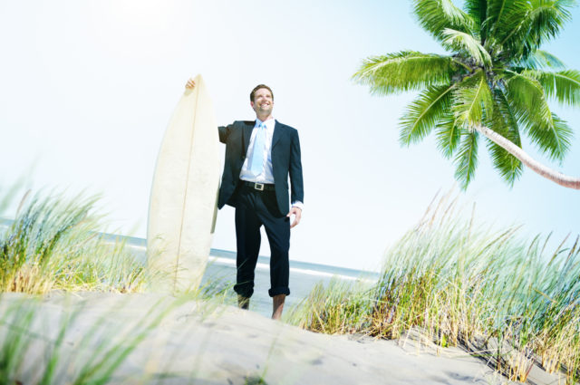 shutterstock_300917867 Businessman Relaxation Surfing Summer Beach Concept Suit Man