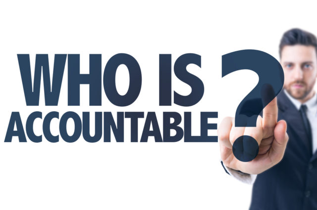 shutterstock_268948466 Business man pointing the text: Who Is Accountable?