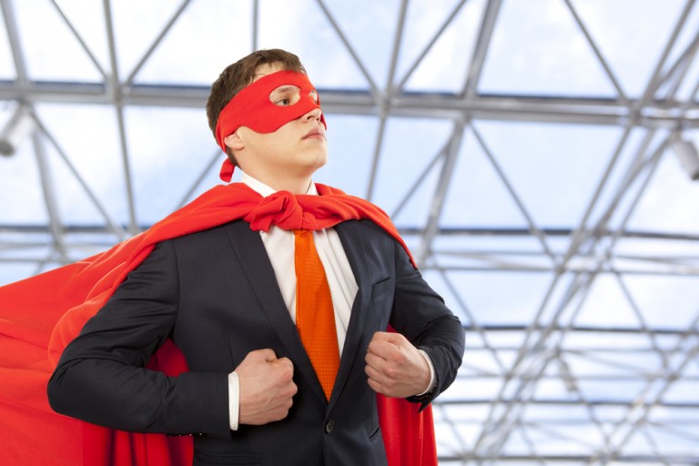 shutterstock_349370756 Businessman superhero in a red cloak. Business concept.