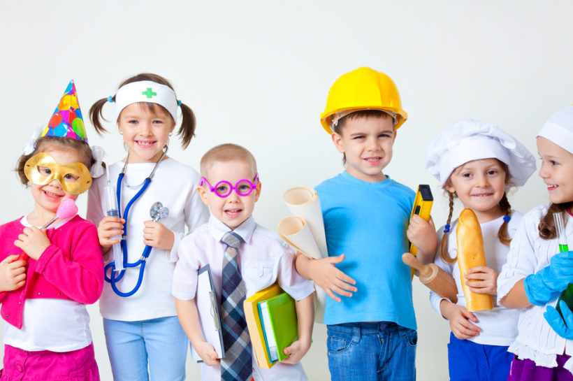shutterstock_127688342 Group of six children dressing up as professions