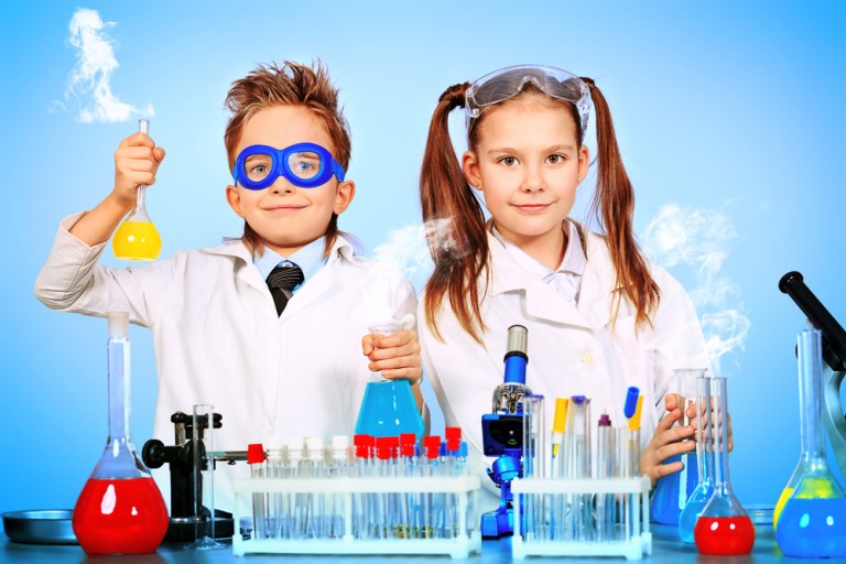 shutterstock_97618565 Two children making science experiments. Education.