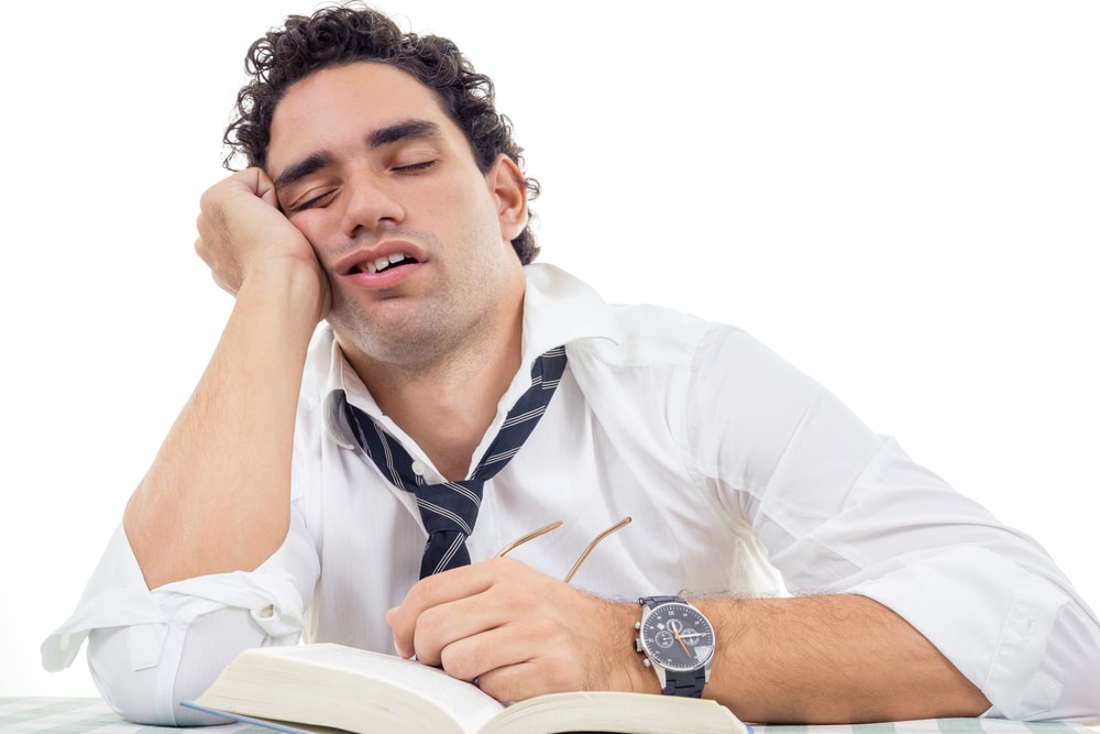 shutterstock_176786162 sleepy and tired man with glasses in white shirt ...