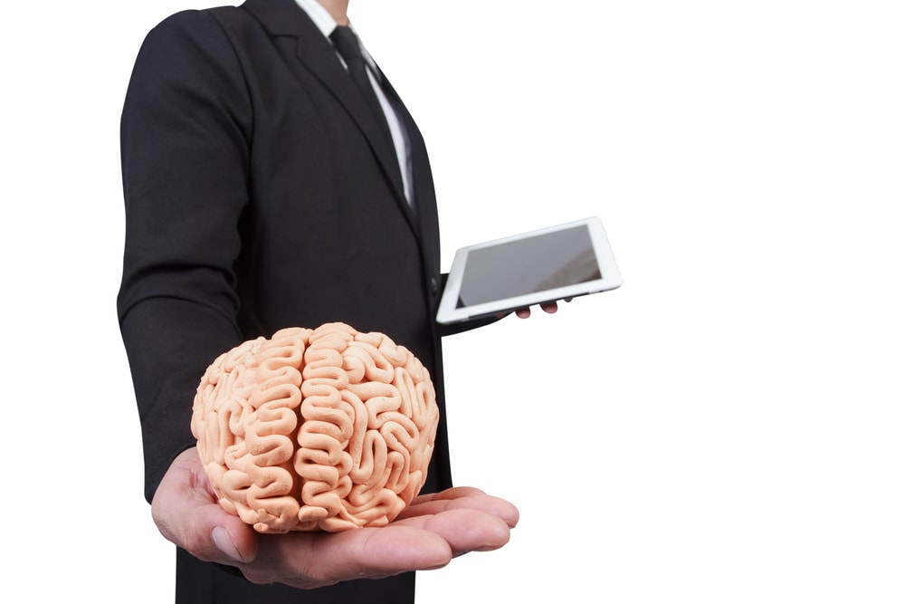 shutterstock_203213209 businessman give the brain in concept idea for successful business