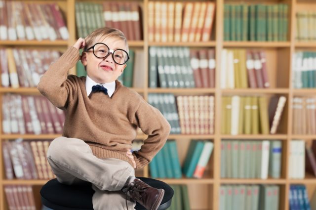 shutterstock_398413027 Question boy glasses library