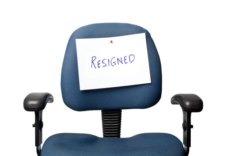 shutterstock_217461136 Office chair with a RESIGNED sign isolated on white background