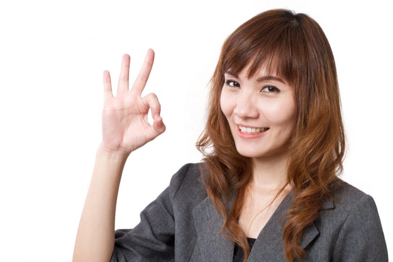 shutterstock_380485834 business woman showing okay hand gesture