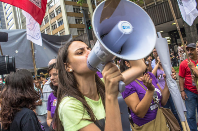 shutterstock_388890277 Sao Paulo, Brazil, March 08, 2016. Thousands of women march through Sao Paulo, Brazil on March 8, 2016 in observance of International Women's Day.