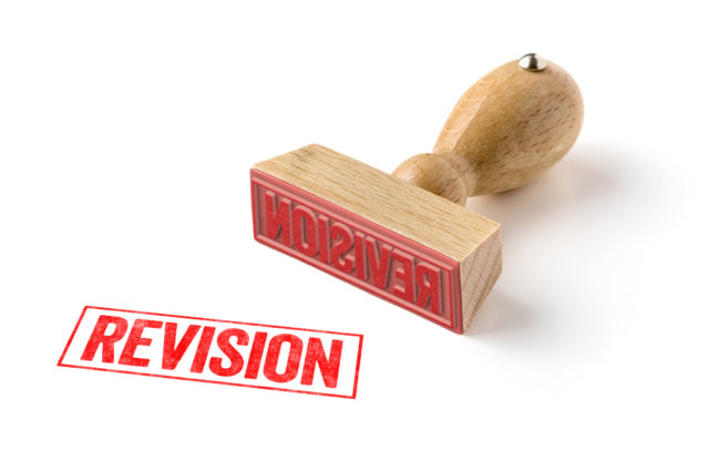 A Rubber Stamp On A White Background - Revision