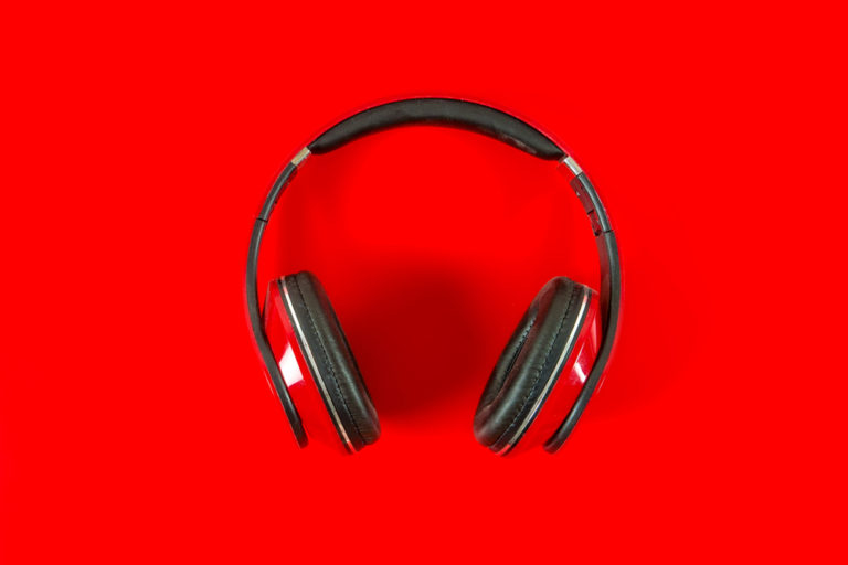 Red Headphones On Red Background