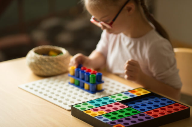 Girl,with,down,syndrome,builds,a,house,out,of,numicon