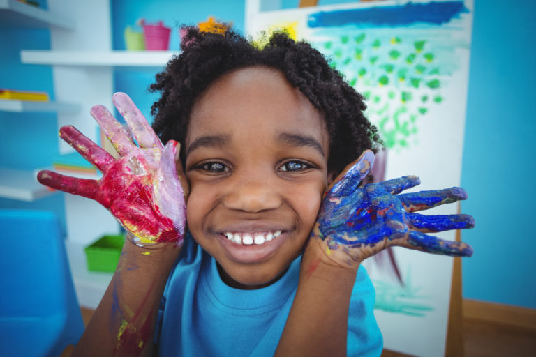 Happy,kid,enjoying,arts,and,crafts,painting,with,his,hands